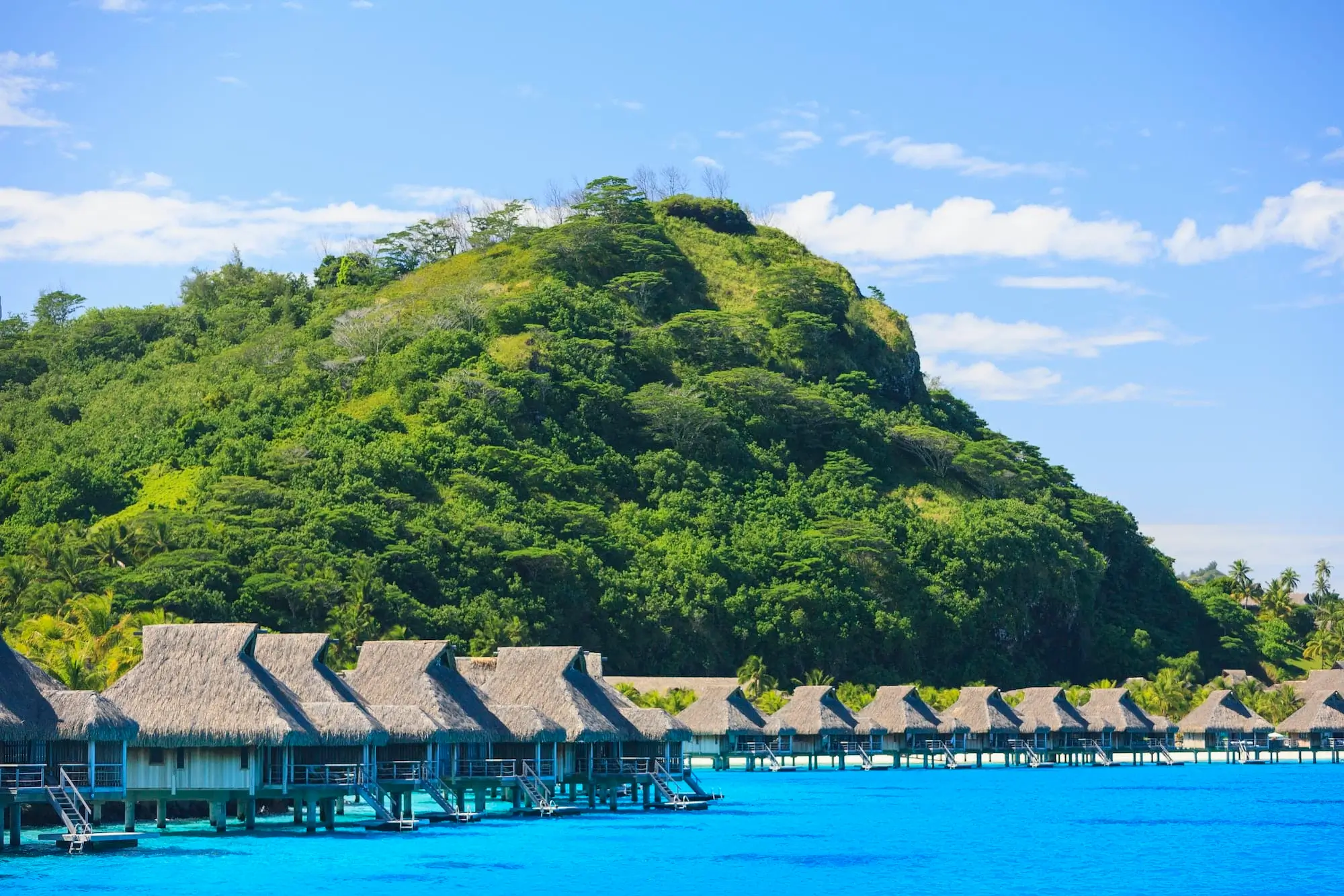 Overwater bungalows at a tropical resort in Bora Bora, French Polynesia