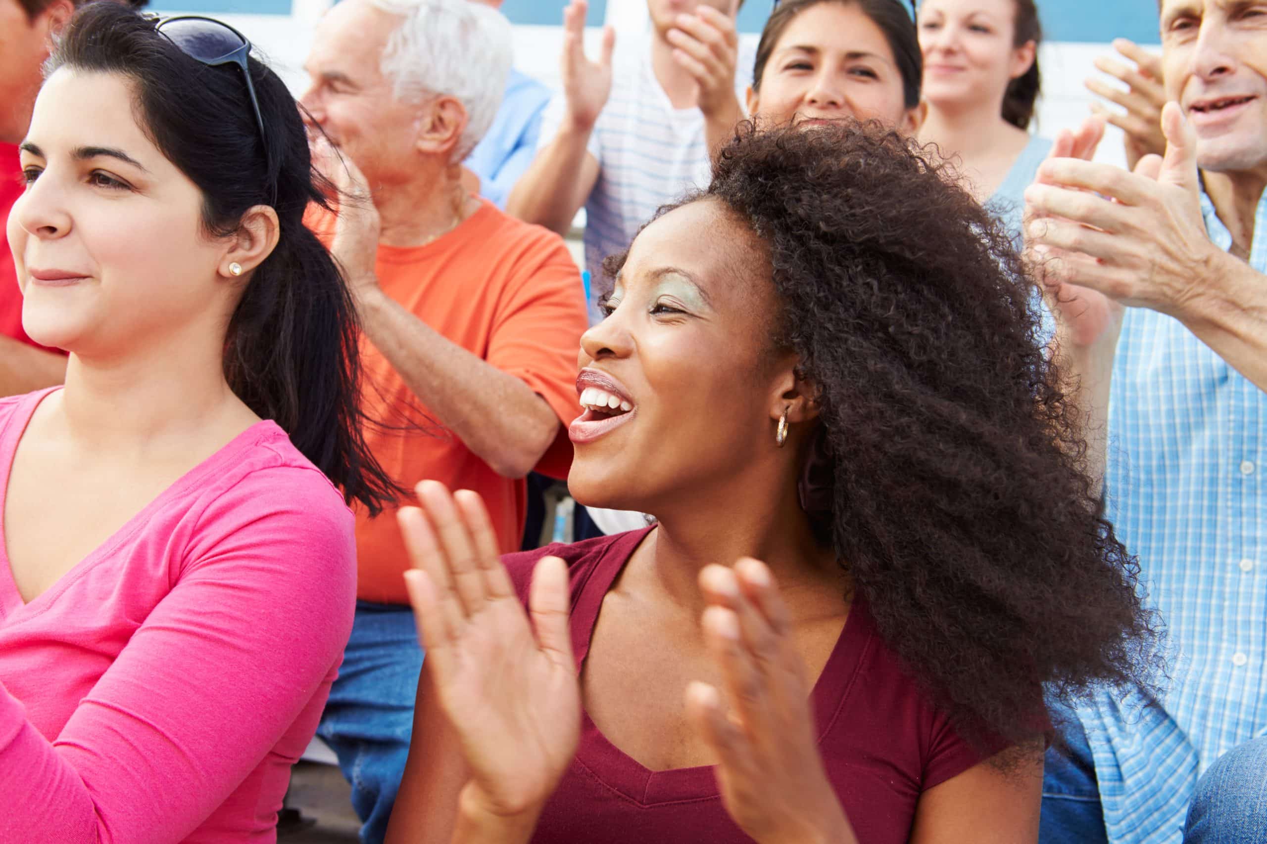 Crowd cheering at an outdoor event